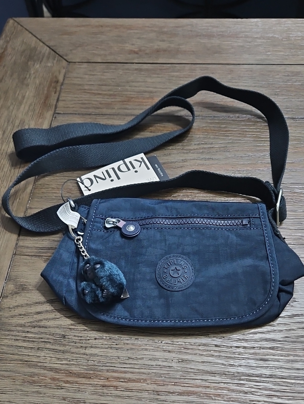 Kipling Navy Blue Crossbody Mini Bag with Pom Pom Charm